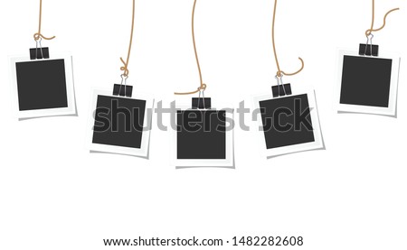 Photo square frames hanging on a black paper clip and beautiful shadow on white background. ストックフォト © 