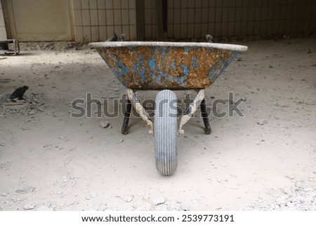 Similar – Image, Stock Photo An old rusty wheelbarrow with a fat black balloon tyre tries to hide in a lilac bush, but doesn’t quite succeed