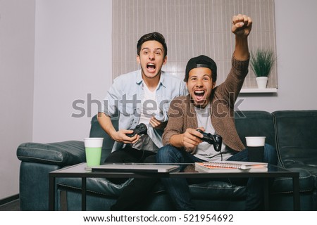 Similar – Image, Stock Photo Concentrated boy playing video game