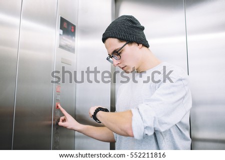 Similar – Image, Stock Photo Serious young stylish guy standing near shabby wall on street