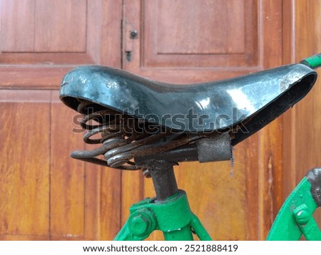 Similar – Image, Stock Photo Old bicycle saddle with visible springs and rust