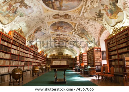 PRAGUE, CZECH REPUBLIC - AUGUST 14: The Theological Hall in Strahov monastery with stucco decoration and paintings from 1720s on August 14, 2009 in Prague. Library with ancient books, globes
