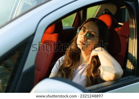 Similar – Image, Stock Photo Pensive woman traveler sitting near calm lake