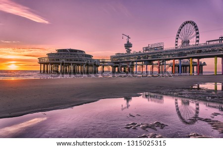 Similar – Image, Stock Photo Scheveningen beach in the evening with a view of the lighthouse and Ferris wheel