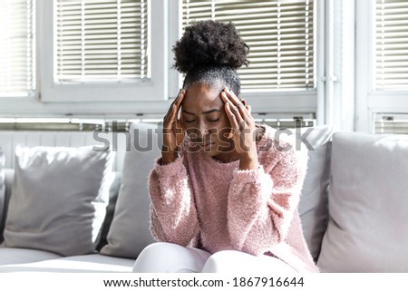 Similar – Image, Stock Photo Upset black woman with dreadlocks against concrete wall