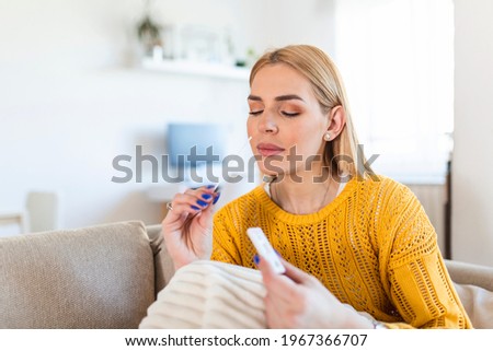 Portrait of relaxed young woman taking a Self-swabbing home tests for COVID-19 at home with Antigen kit. Introducing nasal stick to check the infection of Coronavirus. Quarantine, pandemic. Photo stock © 