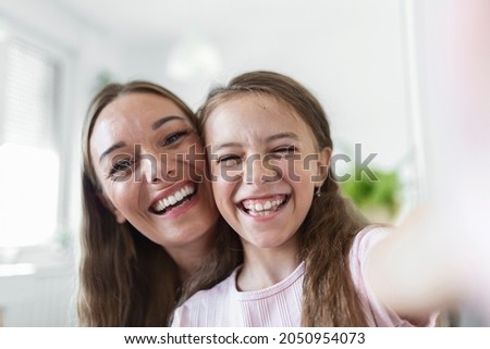 Similar – Image, Stock Photo Analog, close up portrait of a young woman sitting on a bed and looking into the camera