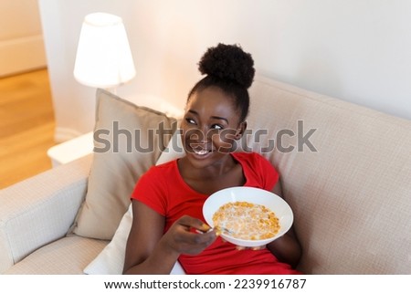 Similar – Image, Stock Photo Ethnic woman eating breakfast on bed