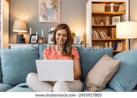 Similar – Image, Stock Photo Woman browsing laptop during online shopping at home