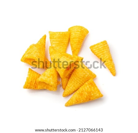 Corn cone pile isolated. Bugles chips, puffs with spices, crunchy puffed snacks, salty corn cones top view Foto stock © 