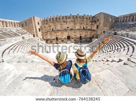 Similar – Image, Stock Photo Friends in amphitheater with television tower