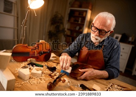 Similar – Foto Bild Handwerker schnitzt Holz in der Werkstatt