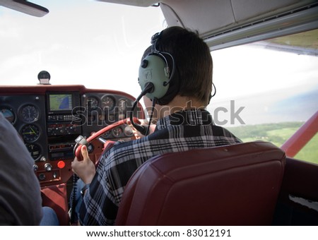 boy fliyng in the plane cabin