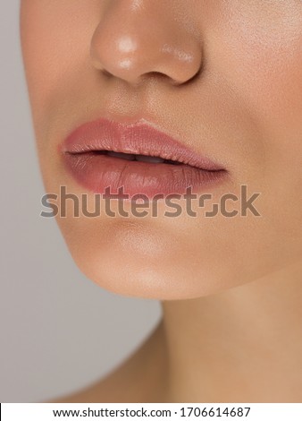 Similar – Image, Stock Photo Closeup of female lips with red lipstick reflected in mirror