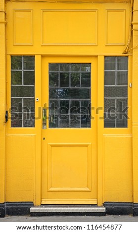 Yellow entrance door to industrial storage space