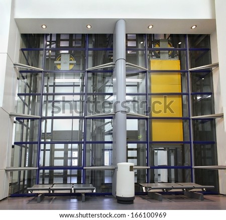 Modern elevator construction with glass walls from outside