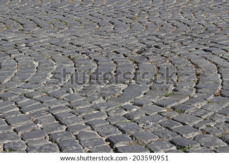Detail of cobblestone road texture with small tiles
