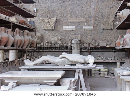 POMPEII, ITALY - June 25; Body of man preserved in plaster cast who died in AD 79 Vesuvius eruption in Pompeii, Italy - June 25, 2014; Man suffocated by volcanic gasses later preserved with plaster