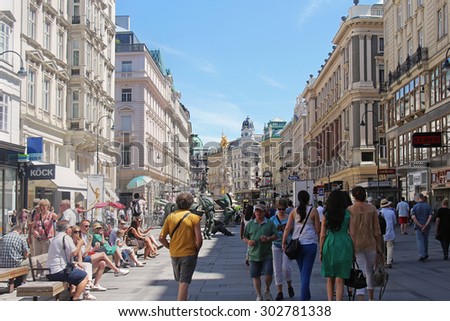 VIENNA, AUSTRIA - JULY 11, 2015; One of the most famous pedestrian streets Graben Street in Vienna, Austria - July 11, 2015: Tourists walking through the Grabeen street in the first district of city