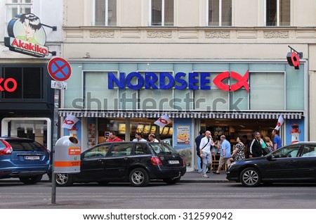 VIENNA, AUSTRIA - JULY 10, 2015; Nordsee is famous German fast-food restaurant chain in Vienna, Austria - July 10, 2015: Tourists walking in front of Nordsee fast-food restaurant in Vienna city center