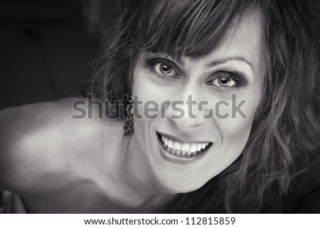 Closeup of a happy young woman  black and white