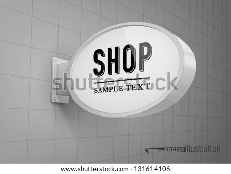 Blank, oval shop sign hanging on a wall