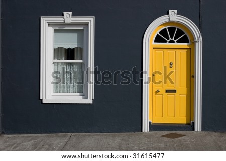 yellow door, white windows, black wall