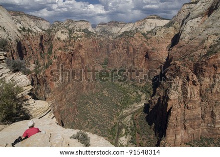 Woman looking from Angel´s landing in Zion national park in United States