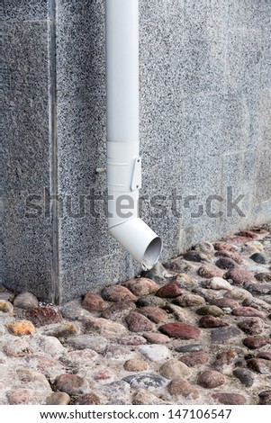 Corner of house with metal drainpipe