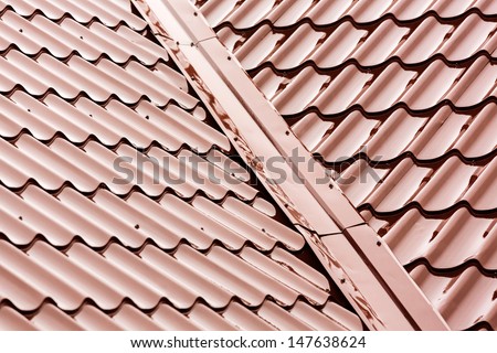 New red tiled metal roof at rain