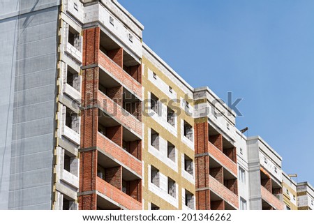 Modern apartment construction site with thermal insulation