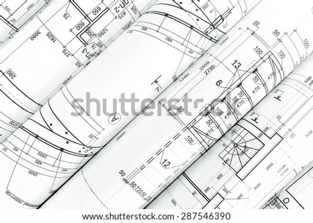 rolls of architecture blueprints and technical drawings, architectural background