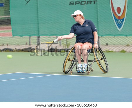 AMSTERDAM - JULY 21: Unidentified athlete participates in Amsterdam Open Wheelchair Tennis competition, held on July 21, 2012 in Amsterdam,The Netherlands