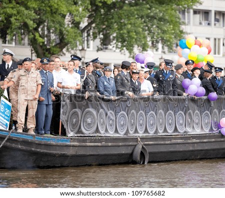 AMSTERDAM - AUG 4: Dutch military participates in the Canal Parade, held during Amsterdam Gay Pride week, August 4, 2012, Amsterdam, The Netherlands
