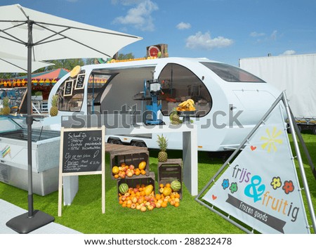 AMSTERDAM, THE NETHERLANDS - MAY 17, 2015: Mobile ice cream parlor Frijs and Fruitig sells fresh fruit ice cream during the annual mobile kitchens weekend, held in the city\'s Culture park.