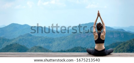 Lifestyle woman yoga exercise and pose for healthy life. Young girl or people pose balance body vital zen meditation for workout nature mountain background in morning sunrise with mat outdoor banner. 