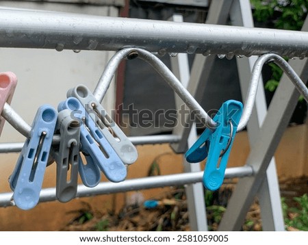 Similar – Image, Stock Photo Clothespin on rain wet clothesline