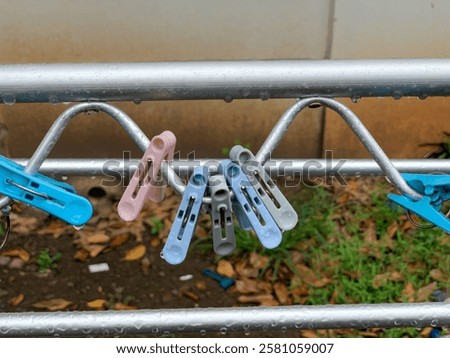 Similar – Image, Stock Photo Clothespin on rain wet clothesline