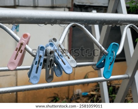 Similar – Image, Stock Photo Clothespin on rain wet clothesline