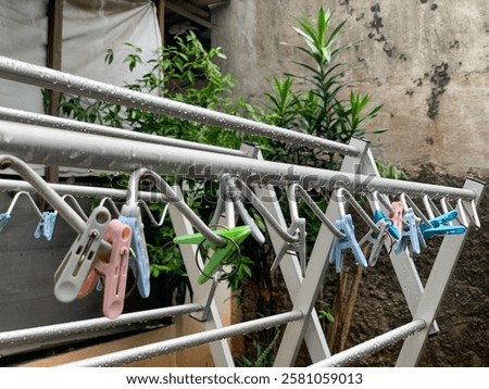 Similar – Image, Stock Photo Clothespin on rain wet clothesline