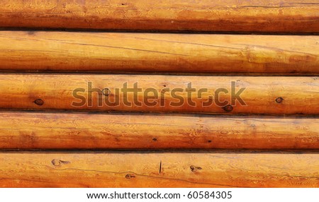 Weathered wooden logs wall of rural house background