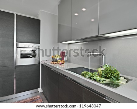 vegetables near to sink in a modern kitchen