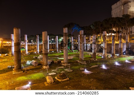 A night time view of pillars at an old Italian temple, one of Rome\'s many tourist attractions.