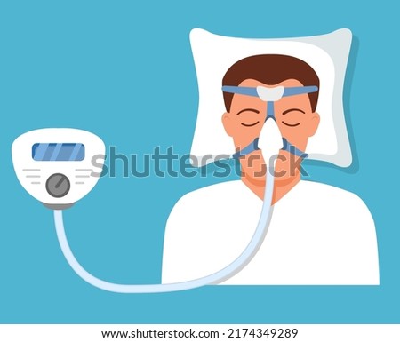 Continuous positive airway pressure.Obstructive sleep apnea. Man lying on bed.Cpap mask.Patient in hospital cpap therapy.mask fitted over a head. The guy with the oxygen mask fitted ov
