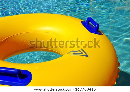 close up of a yellow pool float in pool