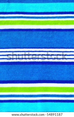 Pretty blue striped beach towel useful as a background pattern
