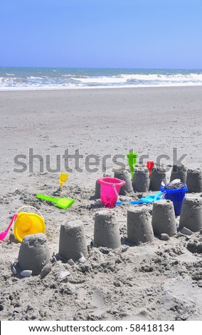 Sand Castle and Toys on the beach, perfect for cover art
