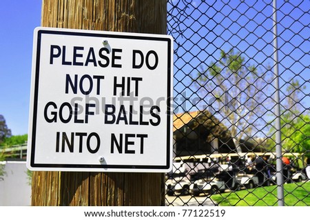 Driving range warning sign at a golf resort