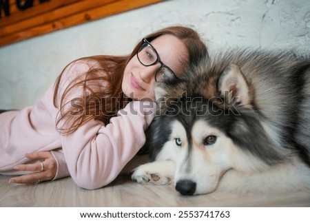 Similar – Image, Stock Photo Husky sledding over a frozen lake at sunset