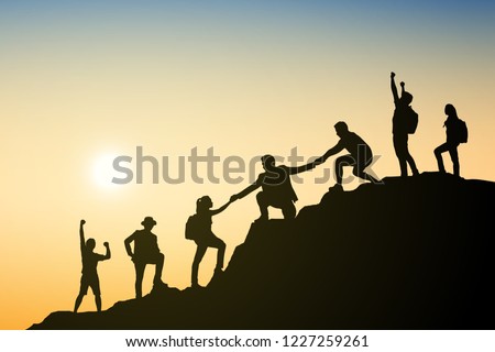 Silhouettes group businessman climbing on mountain and helping at sunset. Help and assistance concept. Eps10 Vector illustration.